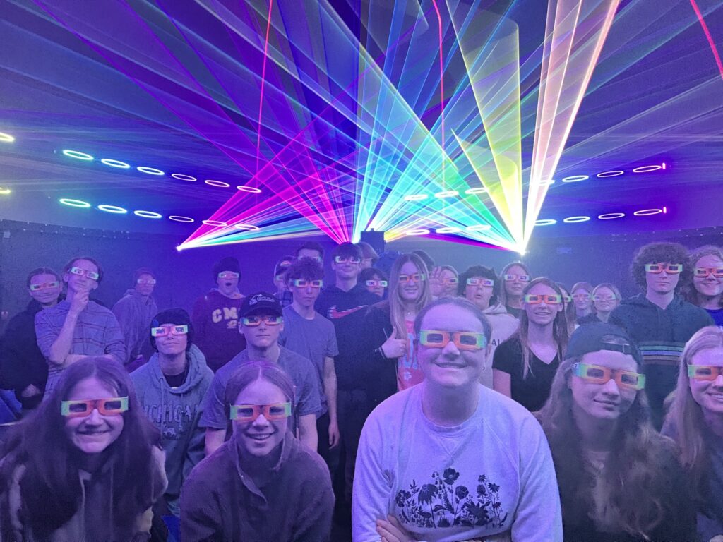 Students under the planetarium lasers